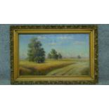 A gilt framed oil on canvas, cornfield, indistinctly signed. 56x84cm