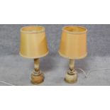 A pair of mid 20th century vintage onyx and gilt metal table lamps. H.40cm