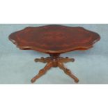 An Italian style mahogany coffee table with shaped and floral inlaid top. H.55 W.99 D.60cm