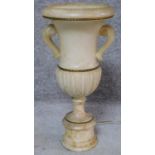 An alabaster table lamp of classical twin handled urn form on pedestal base. H.48cm