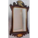 A Georgian mahogany fret carved mirror with carved gilt cresting and satinwood inlaid conch shell