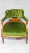 A late Victorian inlaid rosewood tub armchair in buttoned upholstery on turned supports. H.66cm