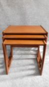 A nest of three mid 20th century teak graduating occasional tables by G-plan, label to underside.