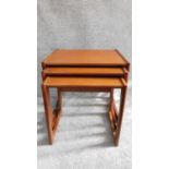 A nest of three mid 20th century teak graduating occasional tables by G-plan, label to underside.