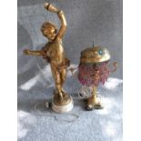 A pair of vintage lamps, one with gilded plaster cherub on a marble base and the other with gilded
