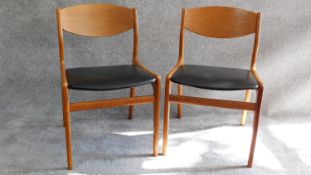 A pair of mid 20th century teak dining chairs. H.75