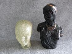 A vintage glass head and ceramic Art Deco African bust with gilded details. H 43cm.