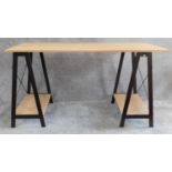 A contemporary trestle style desk. H.75 W.140 D.60cm