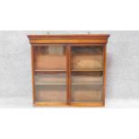 A 19th century mahogany glazed two door bookcase section. H.69 W.74cm