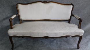 A French style carved frame canape in ivory damask upholstery on cabriole supports. H.95 W.150 D.