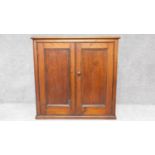 a 19th century stained pine two door cabinet. H.92 W.95 D.47cm