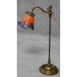 An antique brass lamp with art glass shade. Shade signed. H.47cm