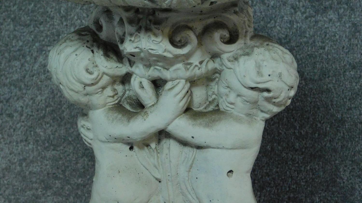 A painted concrete birdbath and seated buddah. Birdbath with three cherubs holding an urn. H.54 ( - Image 6 of 7