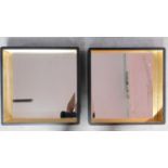 A pair of contemporary gilt and ebonised square wall mirrors. 53x53cm