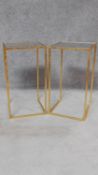 A pair of contemporary gilt metal framed occasional tables with dark smoked glass tops. H.67 W.36