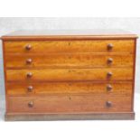 A mid Victorian style mahogany plan chest of five long drawers on plinth base. H.77 W.117 D.80cm