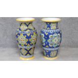 Two large Italian majolica vases with colourful hand painted abstract design. Inscribed on the