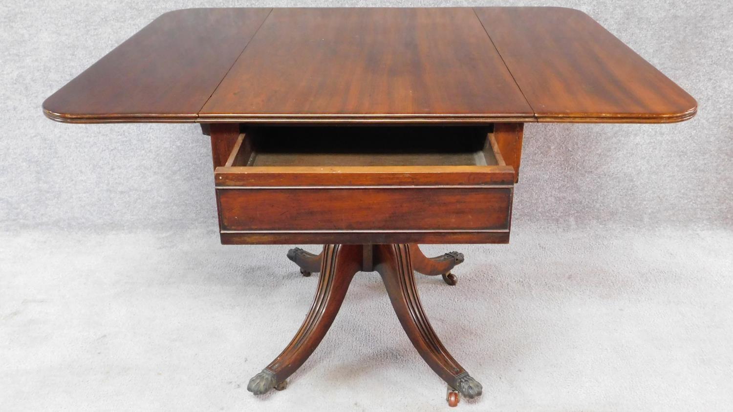 A Regency mahogany drop flap Pembroke table fitted end drawer on swept fluted quadruped supports. - Image 2 of 8