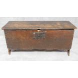 An antique oak plank coffer with panelled cut out sides. H.46 W.98 D.37cm