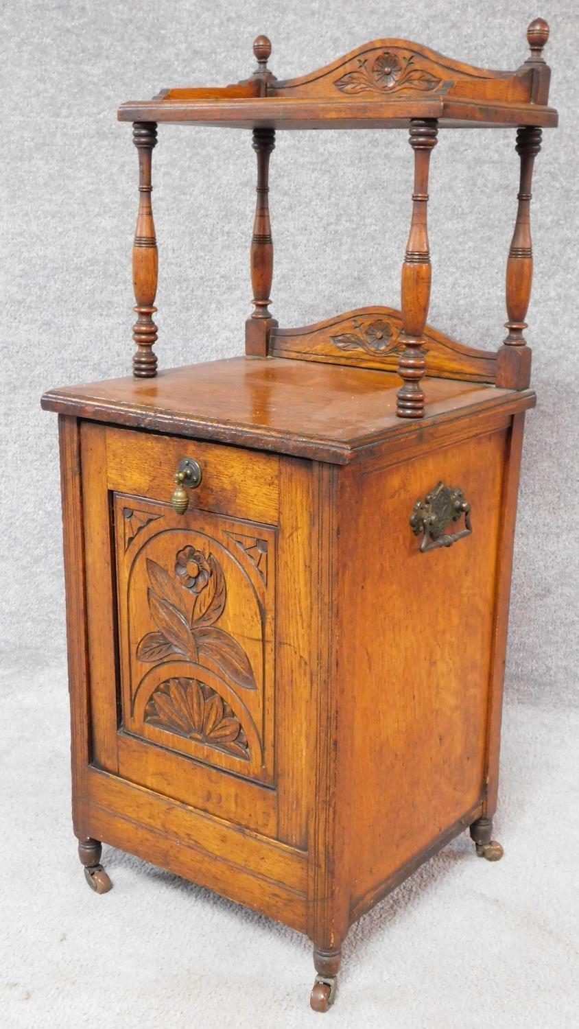 A Victorian oak coal purdonium with carved floral fall front revealing coal compartment. H.97 W.39 - Image 2 of 11