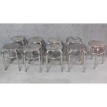 A set of nine low chrome stools. H.43cm