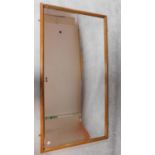 A large framed hall mirror in teak frame fitted bevelled plate. 195x100cm