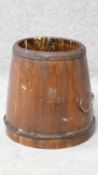 A 19th century wooden Chinese grain bucket with carved Chinese characters to the side. Brass handles