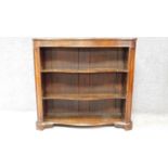 A Victorian rosewood serpentine fronted open bookcase on shaped bracket feet. H.89 W.96 D.29cm