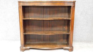 A Victorian rosewood serpentine fronted open bookcase on shaped bracket feet. H.89 W.96 D.29cm