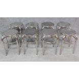 A set of eight low chrome stools. H.43cm