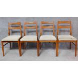 A set of four mid 20th century teak dining chairs. H.84cm