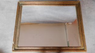 A rectangular gilt framed wall mirror. 92x117cm