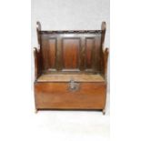 An antique oak small hall seat with panelled back and hinged lid to base. H.105 W.80 D.34cm