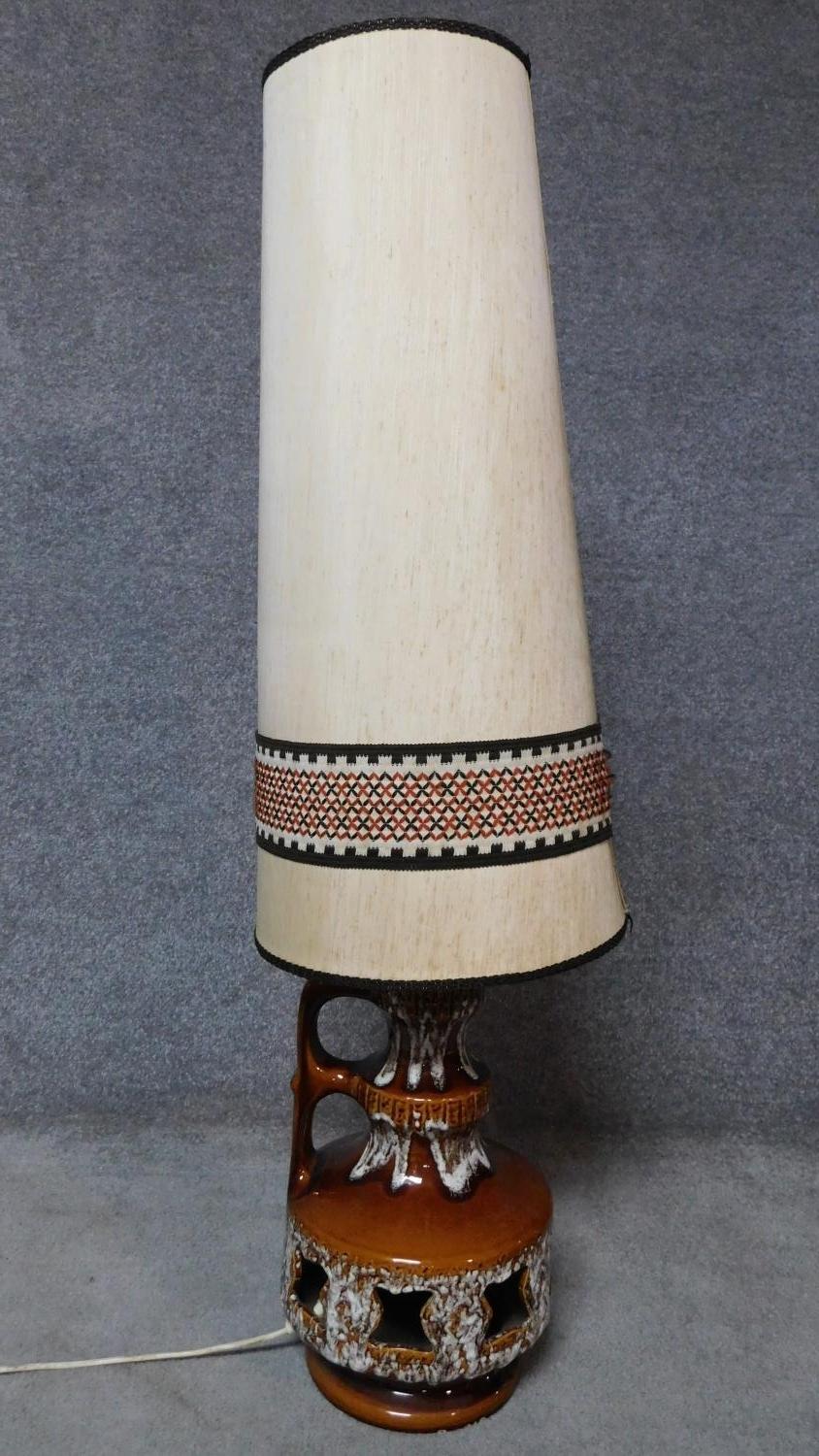 A vintage Skandesco mid-century drip glazed twin handled jug shaped ceramic lamp base and shade. H.