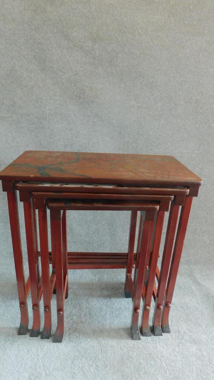 A nest of four Chinese style red lacquered graduating occasional tables on swept square section - Image 2 of 5