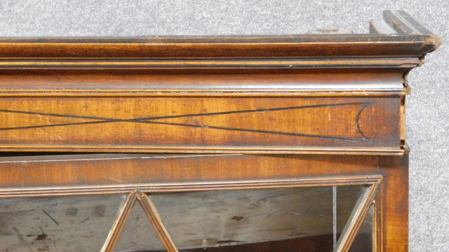 A late Georgian mahogany library bookcase with upper glazed section above fitted central - Image 4 of 9