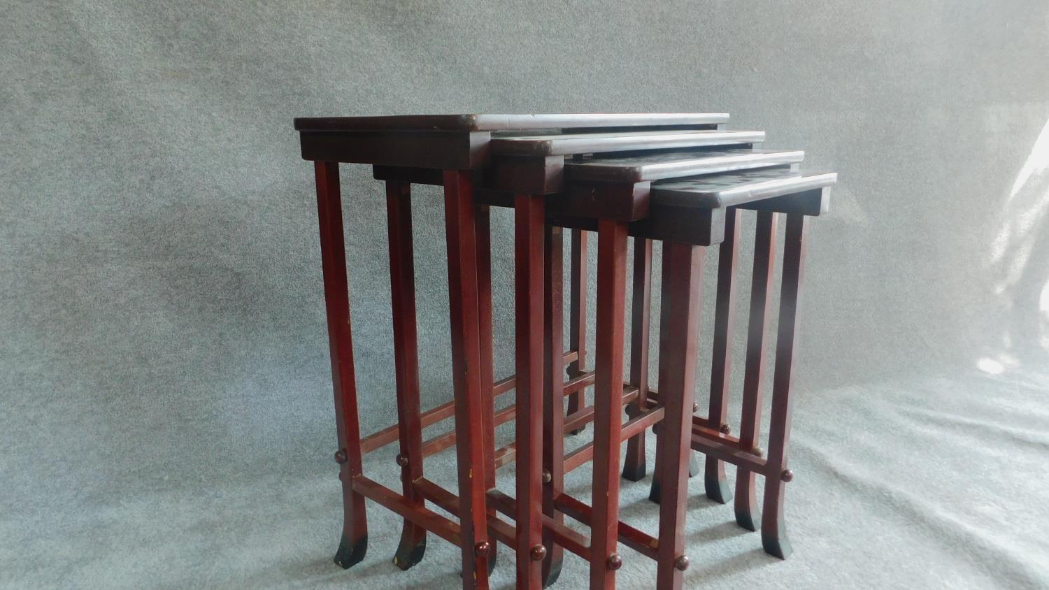A nest of four Chinese style red lacquered graduating occasional tables on swept square section - Image 4 of 5
