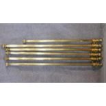 Five miscellaneous brass curtain poles with rings. L.176 (longest)