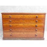 A mid Victorian style mahogany plan chest of five long drawers on plinth base. H.77 W.117 D.80cm