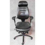 A black leather upholstered executive's desk chair with various tilting actions. H.94cm