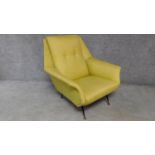 A vintage 1970's armchair in lemon upholstery on dansette style supports. H.86 W.85 D.80cm