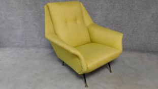 A vintage 1970's armchair in lemon upholstery on dansette style supports. H.86 W.85 D.80cm