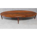 A large oval mid 20th century Danish rosewood coffee table. H.40 W.188 D.84cm