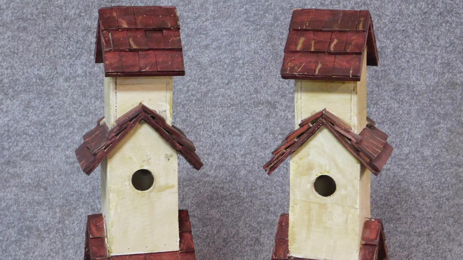 A pair of multi tiered bird houses. H.81cm - Image 2 of 4