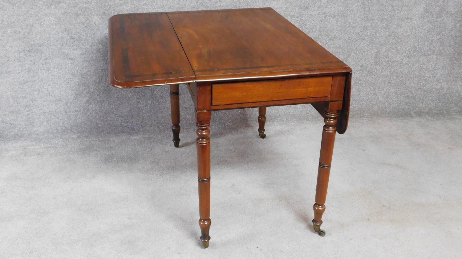 A 19th century mahogany drop flap Pembroke table on ring turned tapering supports terminating in - Image 2 of 5