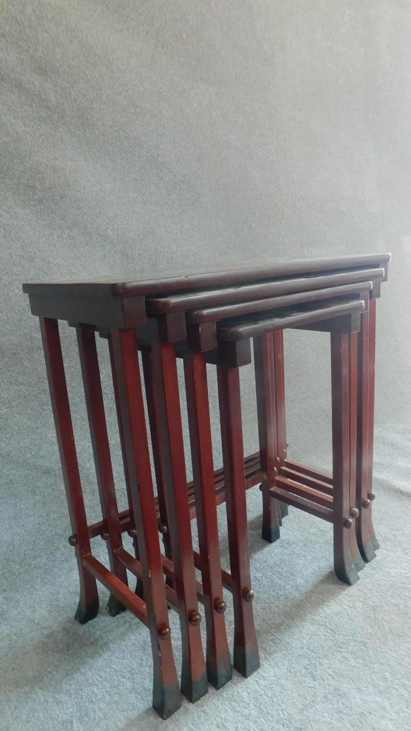 A nest of four Chinese style red lacquered graduating occasional tables on swept square section - Image 3 of 5