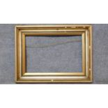 A 19th century gilt and gesso picture frame. 77x102cm