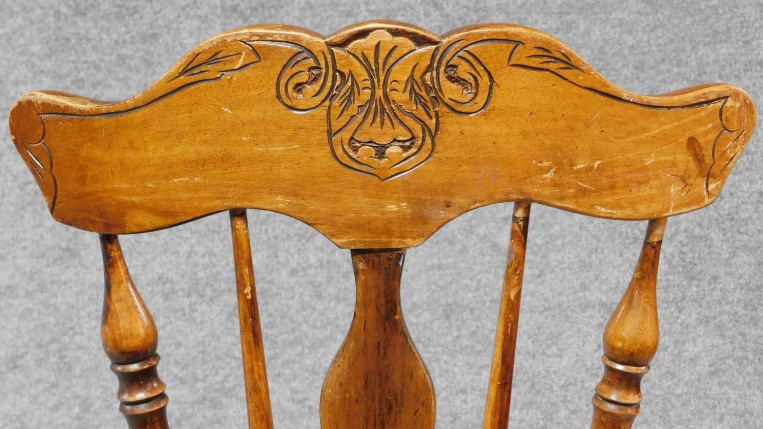 A Victorian walnut revolving piano stool with foliate carving to the back on reeded stretchered - Image 14 of 14