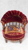 A Victorian tapestry upholstered mahogany framed tub armchair with revolving action. H.73cm