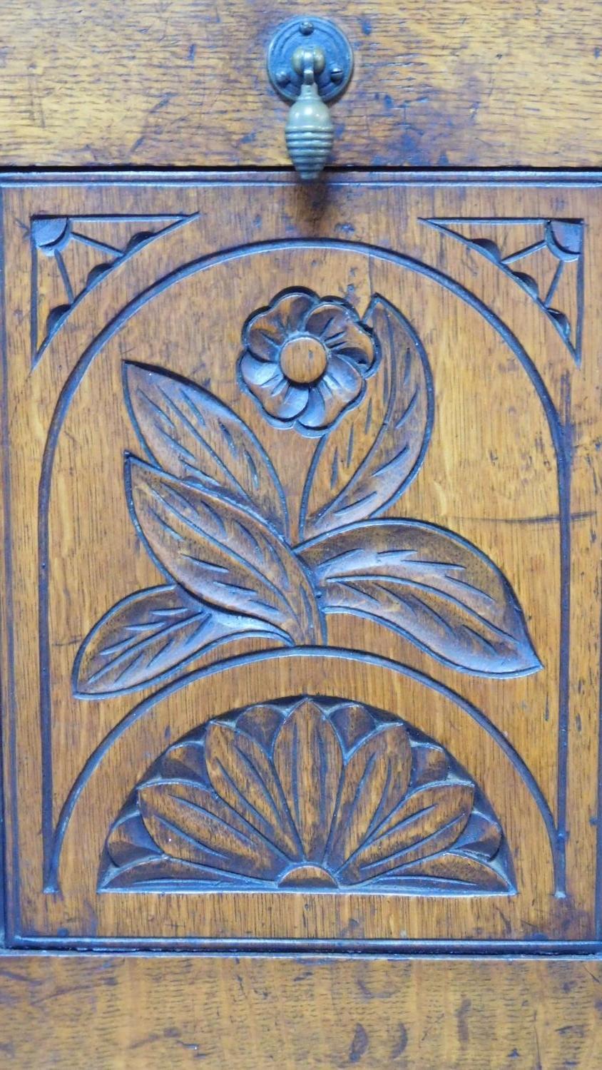 A Victorian oak coal purdonium with carved floral fall front revealing coal compartment. H.97 W.39 - Image 7 of 11
